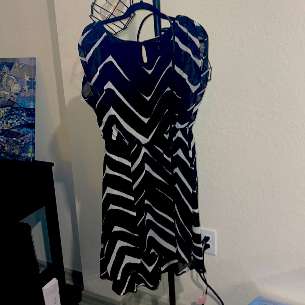 Adorable dress black and white with belt size small like new.